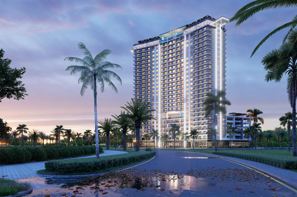 Marbella Tower entry drive at dusk lined with palms and reflecting pavement