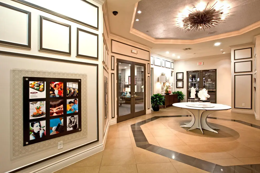 Lobby entry at Post Oak Apartments with coffered ceiling, sputnik chandelier, and patterned tile floor